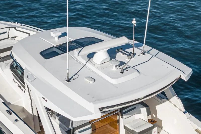 Slide: The Image of Tiara Yachts 38 LS 2019 on calm water, aerial view. - 22