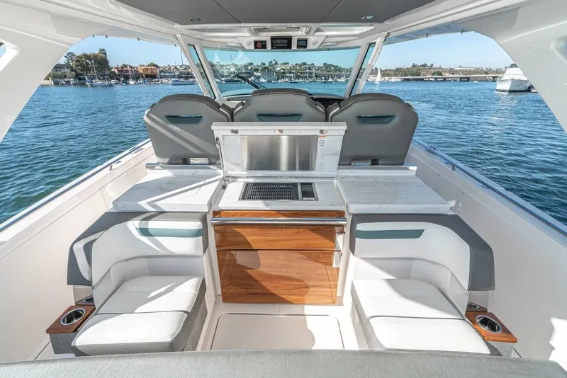 Slide: The Image of Interior of 2019 Tiara Yachts 38 LS with seating and water view. - 25