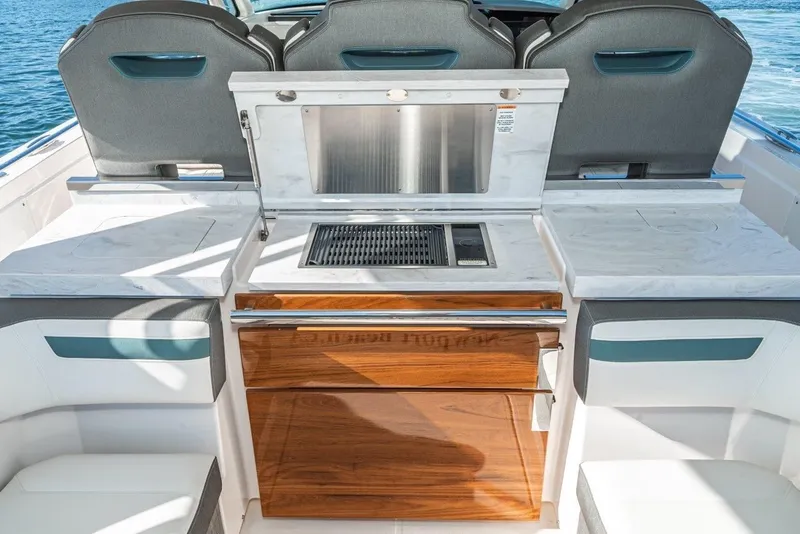 Slide: The Image of Interior of 2019 Tiara Yachts 38 LS with grill and seating. - 26