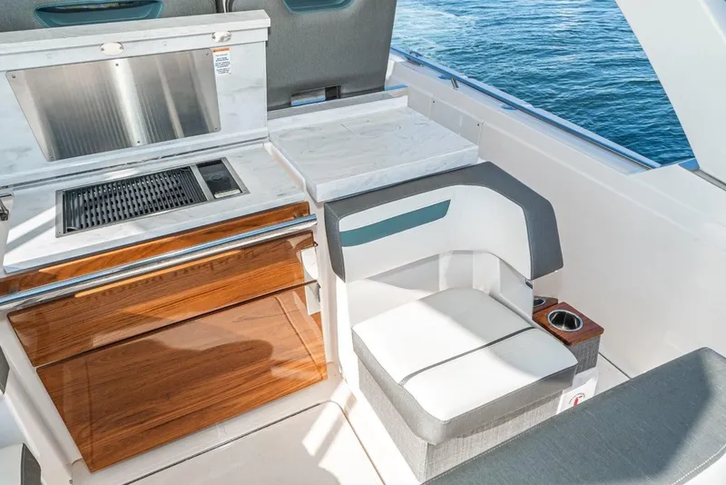 Slide: The Image of Interior of 2019 Tiara Yachts 38 LS with seating and grill. - 27
