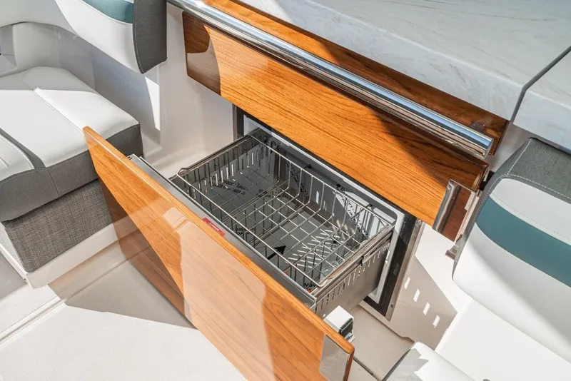 Slide: The Image of Tiara Yachts 38 LS 2019 with open dishwasher. - 28