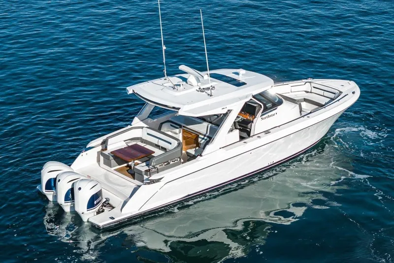 Slide: The Image of 2019 Tiara Yachts 38 LS on calm water, luxurious design. - 3