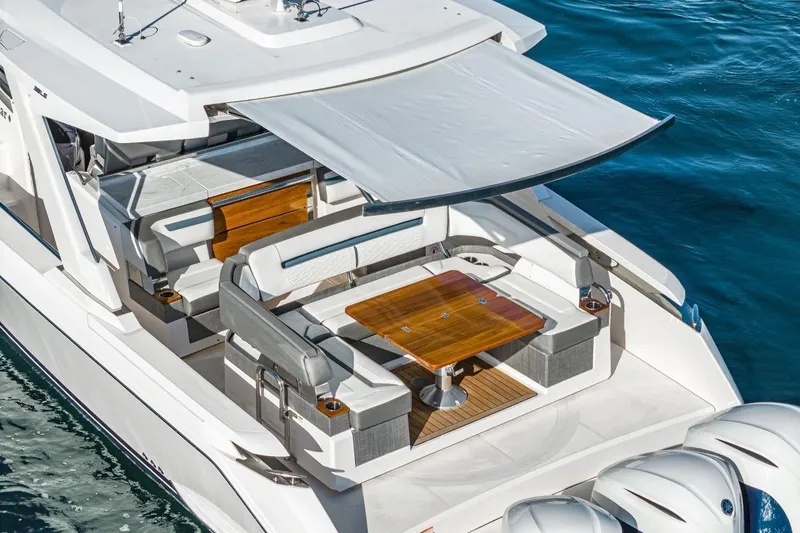 Slide: The Image of 2019 Tiara Yachts 38 LS with luxurious deck and sunshade. - 30