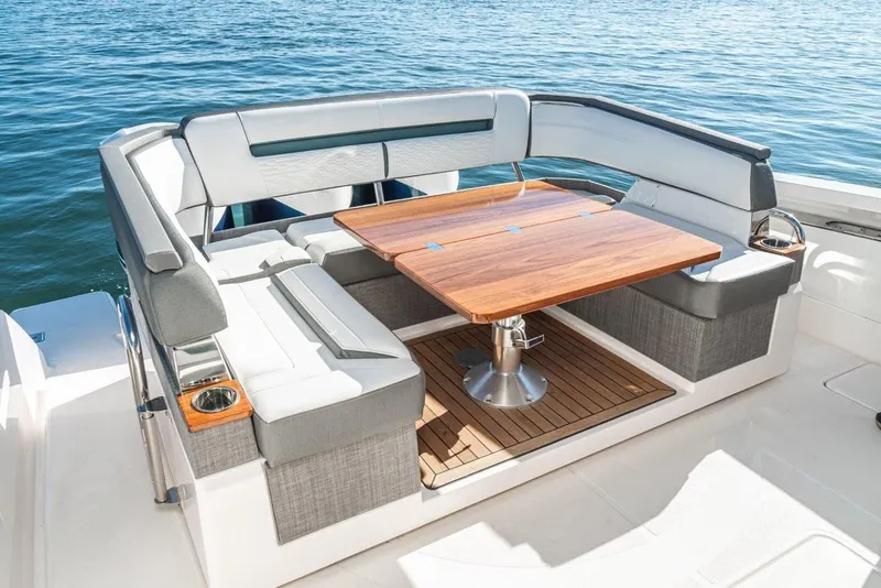 Slide: The Image of 2019 Tiara Yachts 38 LS, luxury seating area on water. - 35