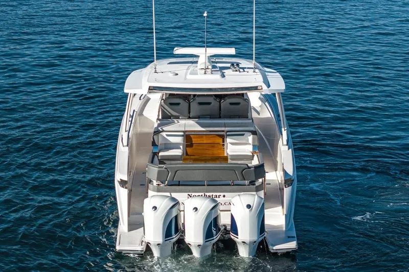 Slide: The Image of 2019 Tiara Yachts 38 LS on open water, rear view. - 37