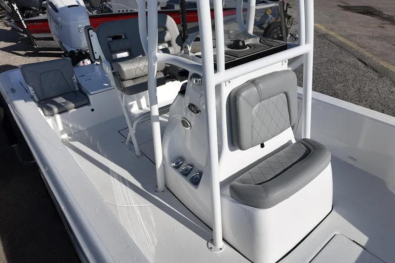 Slide: The Image of 2026 Blazer PureBay 2400 boat interior with gray seating and console. - 10