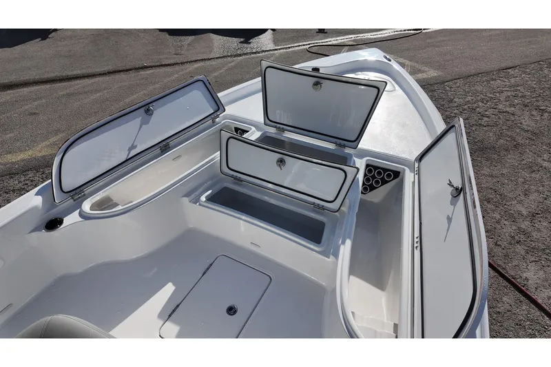 Slide: The Image of 2026 Blazer PureBay 2400 boat storage compartments open, showcasing spacious interior design. - 8
