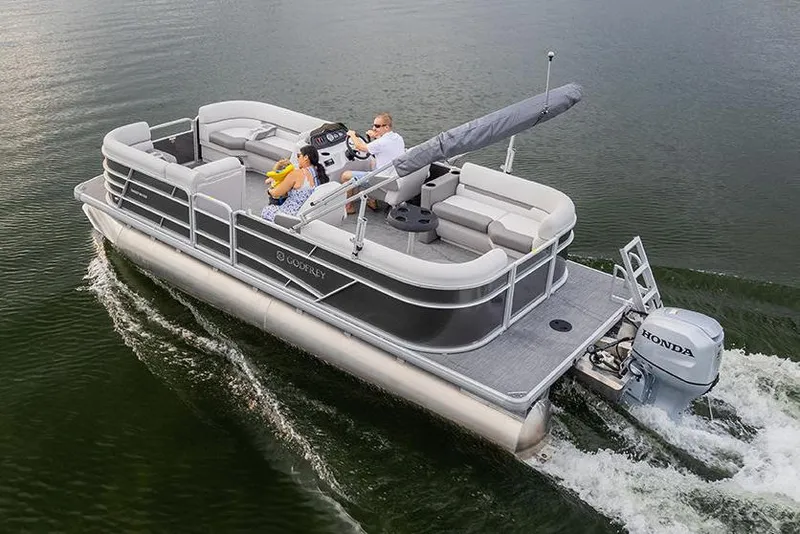 The Image of Manufacturer Provided Image: 2022 Godfrey Sweetwater 2286 SBX pontoon boat cruising on a lake. - 0