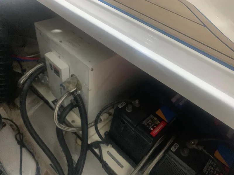 Slide: The Image of 2008 Four Winns V258 boat engine compartment with batteries and wiring. - 20