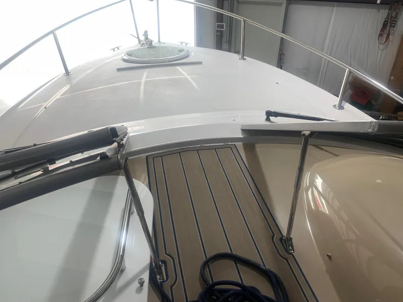 Slide: The Image of 2008 Four Winns V258 boat deck with railing and hatch in a storage area. - 28