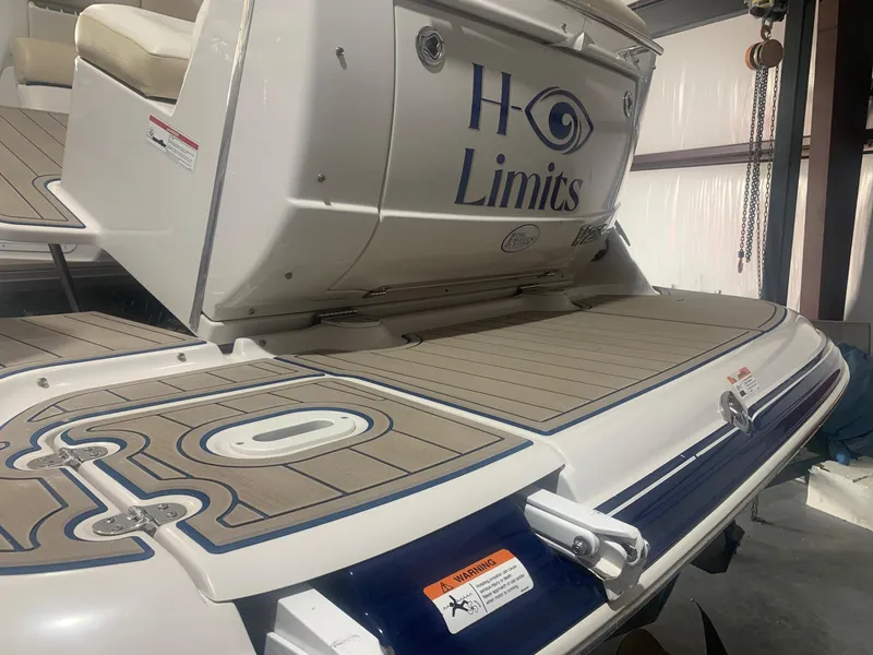 Slide: The Image of 2008 Four Winns V258 boat with custom "H Limits" branding on the deck. - 37