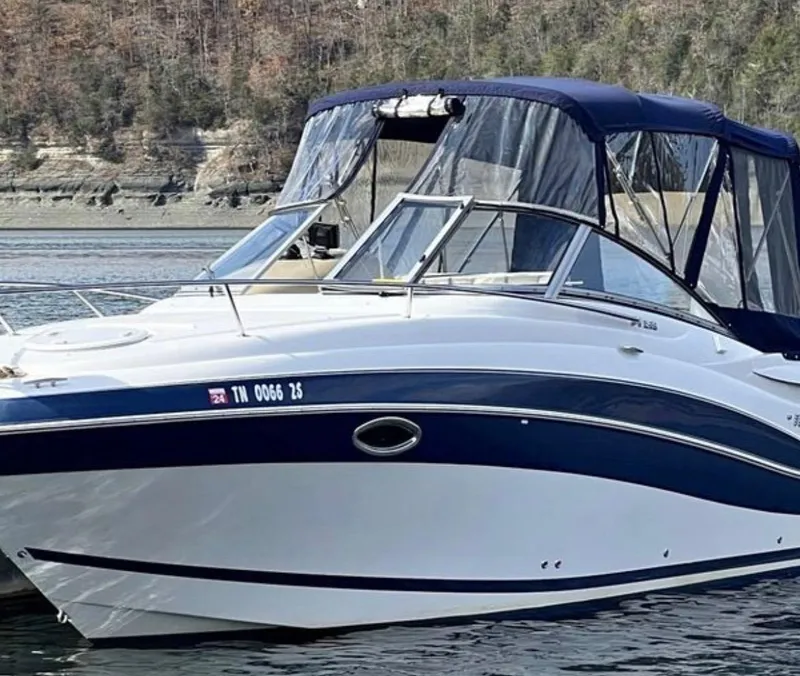 Slide: The Image of 2008 Four Winns V258 boat on calm water with forested shoreline. - 4