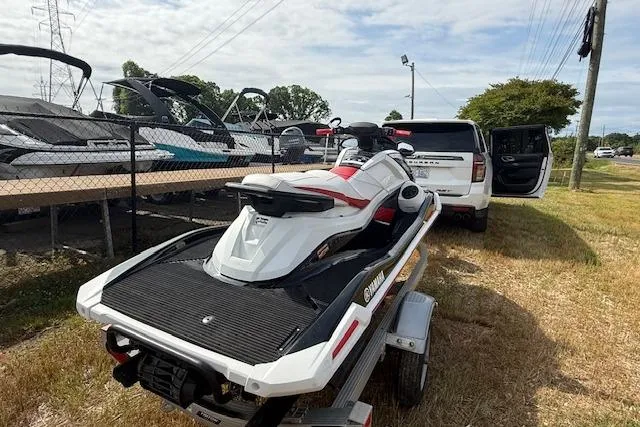 Slide: The Image of 2021 Yamaha WaveRunner VX Deluxe on trailer, parked beside SUV, near boats. - 3