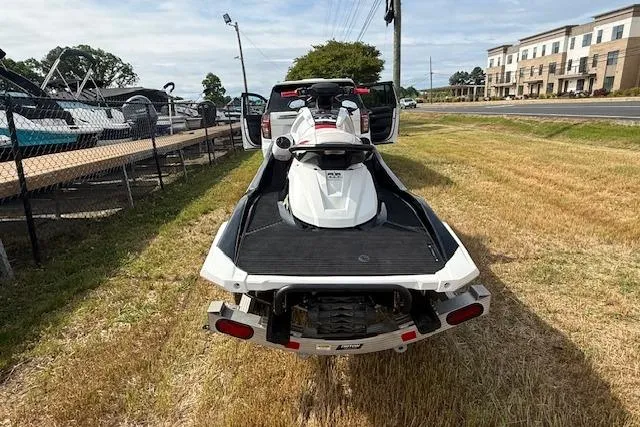 Slide: The Image of 2021 Yamaha WaveRunner VX Deluxe on trailer, parked near boats and buildings. - 4