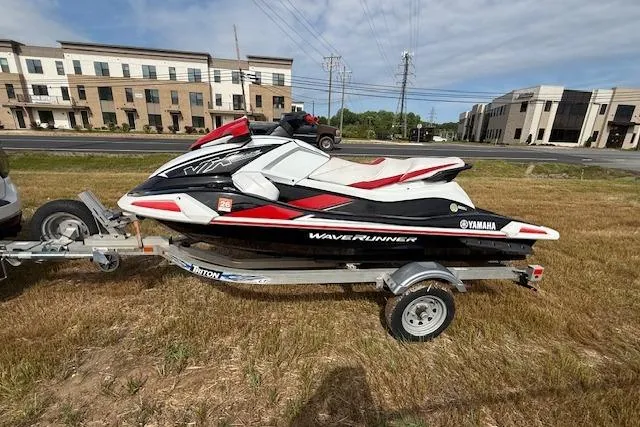 Slide: The Image of 2021 Yamaha WaveRunner VX Deluxe on trailer, parked outdoors near buildings. - 6