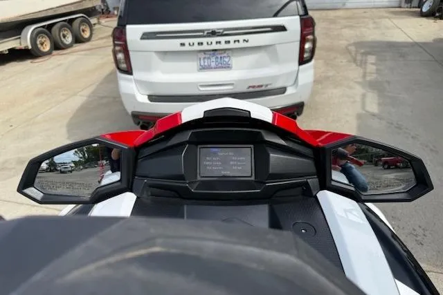 Slide: The Image of 2021 Yamaha WaveRunner VX Deluxe dashboard with mirrors, parked near a white SUV. - 9