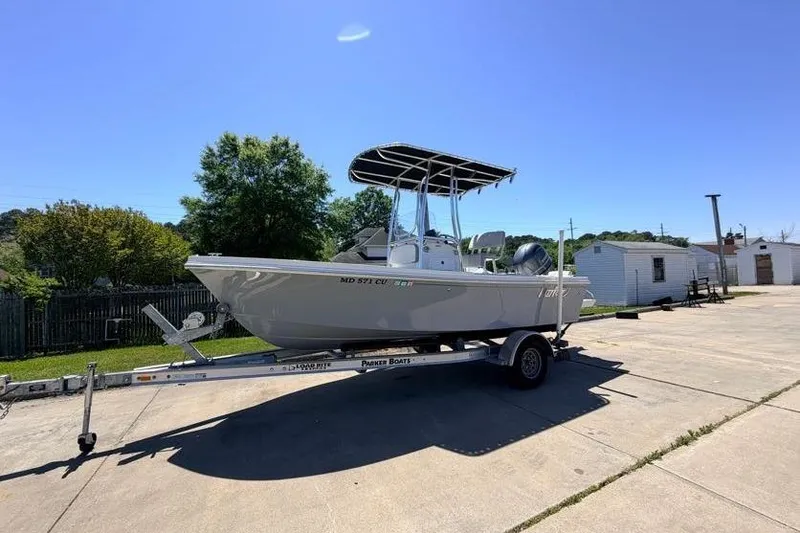 The Image of 2022 Parker 1801 Center Console boat on trailer, sunny day, outdoor setting. - 1