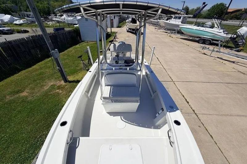 Slide: The Image of 2022 Parker 1801 Center Console boat on display at a marina. - 10