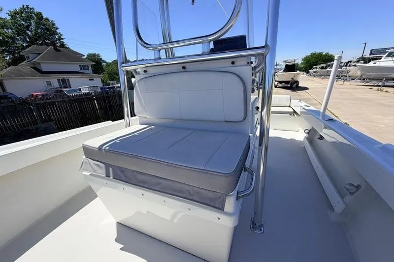 Slide: The Image of 2022 Parker 1801 Center Console boat with cushioned seating, docked outdoors. - 12