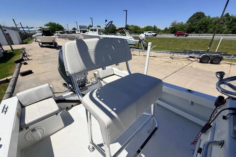 Slide: The Image of 2022 Parker 1801 Center Console boat with seating, parked outdoors on a sunny day. - 14