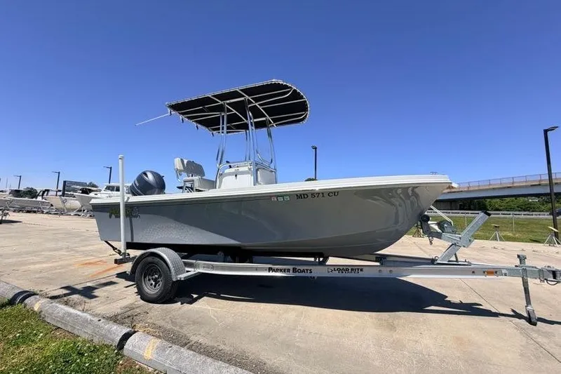 Slide: The Image of 2022 Parker 1801 Center Console boat on trailer under clear blue sky. - 5