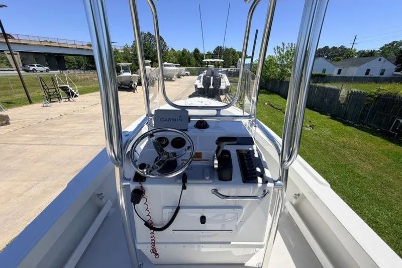 Slide: The Image of 2022 Parker 1801 Center Console boat with Garmin navigation, docked outdoors. - 6