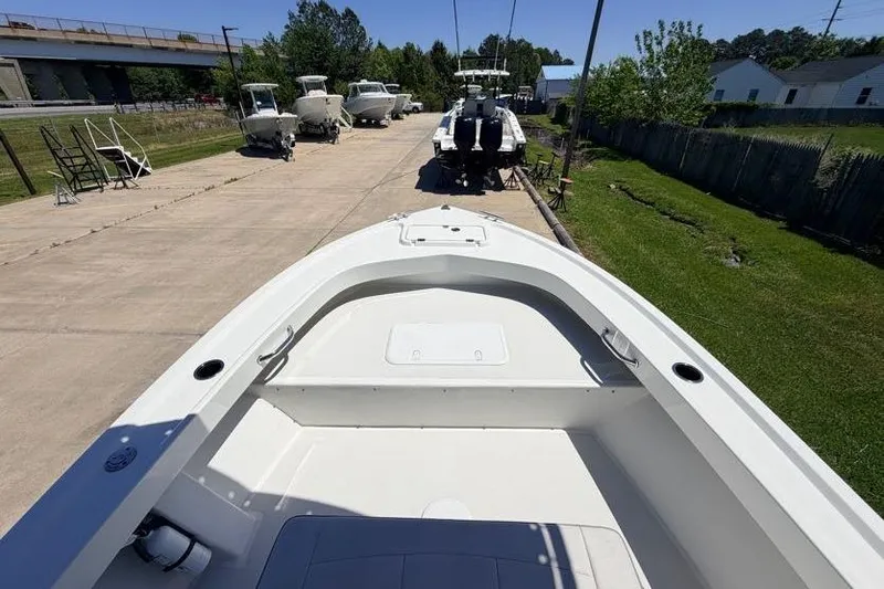 Slide: The Image of 2022 Parker 1801 Center Console boat on a sunny day, parked on a concrete driveway. - 8
