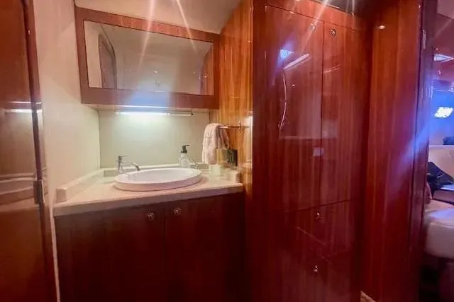 Slide: The Image of Luxurious bathroom interior of 2011 Regal 46 Sport Coupe yacht with wooden cabinetry. - 14