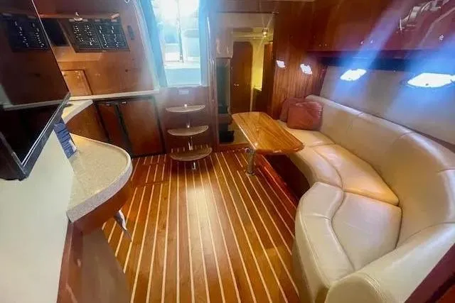 Slide: The Image of Luxurious interior of 2011 Regal 46 Sport Coupe yacht with elegant wood flooring. - 21