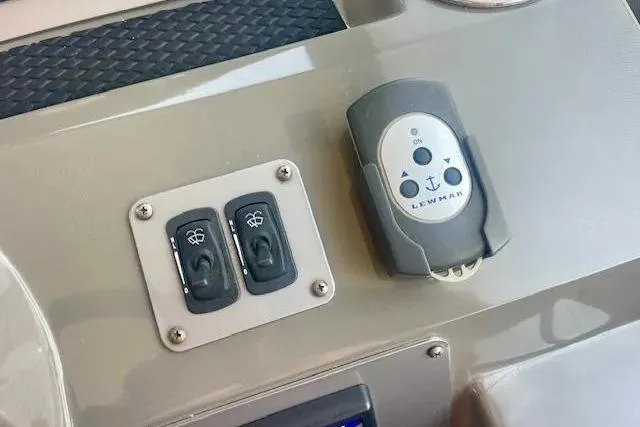 Slide: The Image of Control panel of a 2011 Regal 46 Sport Coupe with Lewmar switches. - 28
