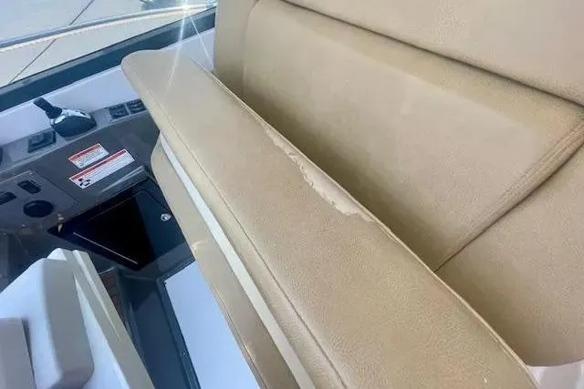 Slide: The Image of 2011 Regal 46 Sport Coupe interior with beige seating and control panel. - 33
