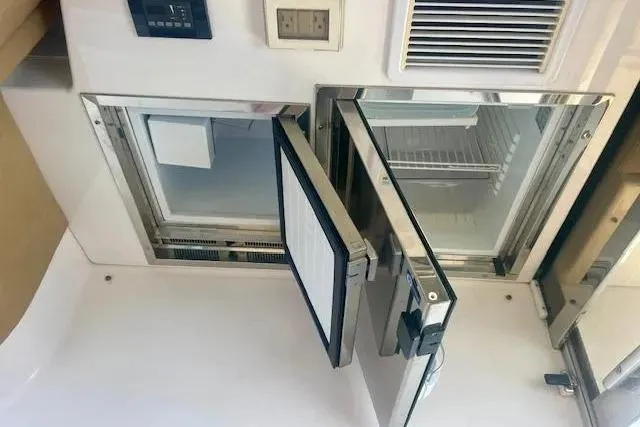 Slide: The Image of Interior view of a 2011 Regal 46 Sport Coupe yacht refrigerator. - 37