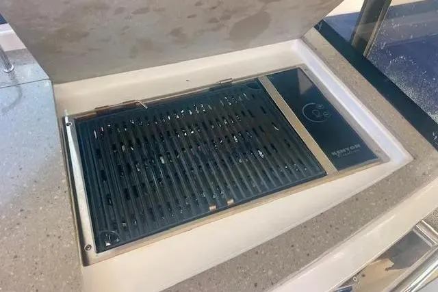 Slide: The Image of Built-in grill on 2011 Regal 46 Sport Coupe yacht's countertop. - 38