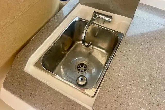 Slide: The Image of Stainless steel sink on 2011 Regal 46 Sport Coupe yacht's countertop. - 39