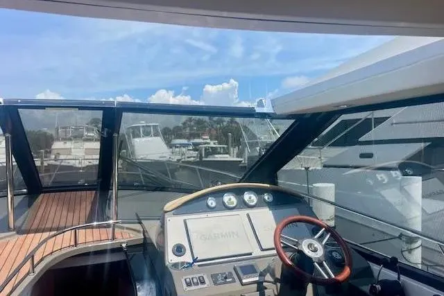 Slide: The Image of Cockpit view of 2011 Regal 46 Sport Coupe yacht with modern navigation equipment. - 40