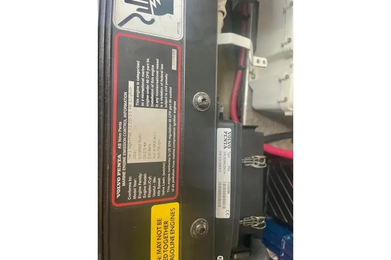 Slide: The Image of Volvo Penta engine label on 2011 Regal 46 Sport Coupe, showing emission control information. - 42