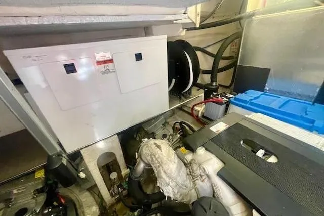 Slide: The Image of Engine room of 2011 Regal 46 Sport Coupe with visible machinery and components. - 46