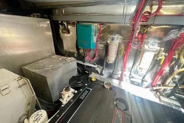 Slide: The Image of Engine room of 2011 Regal 46 Sport Coupe with wiring and components. - 49