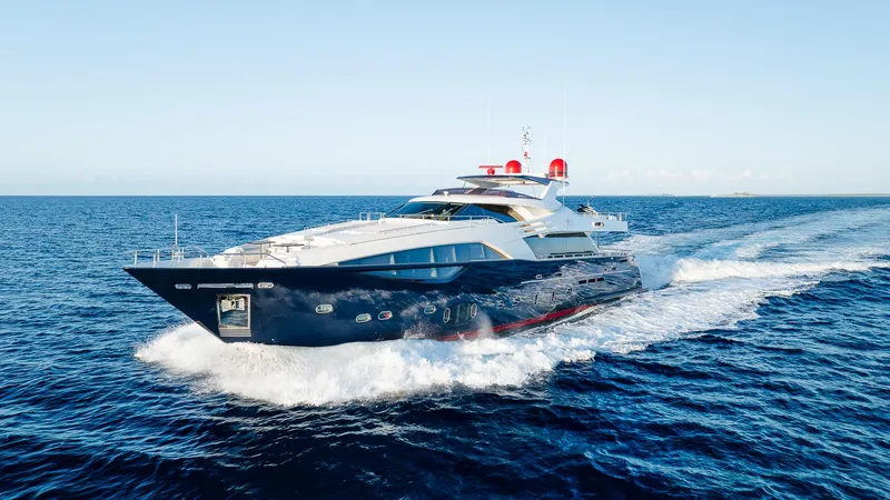 The Image of Luxurious 2012 Custom Line 100 yacht cruising on open sea under clear blue sky. - 0