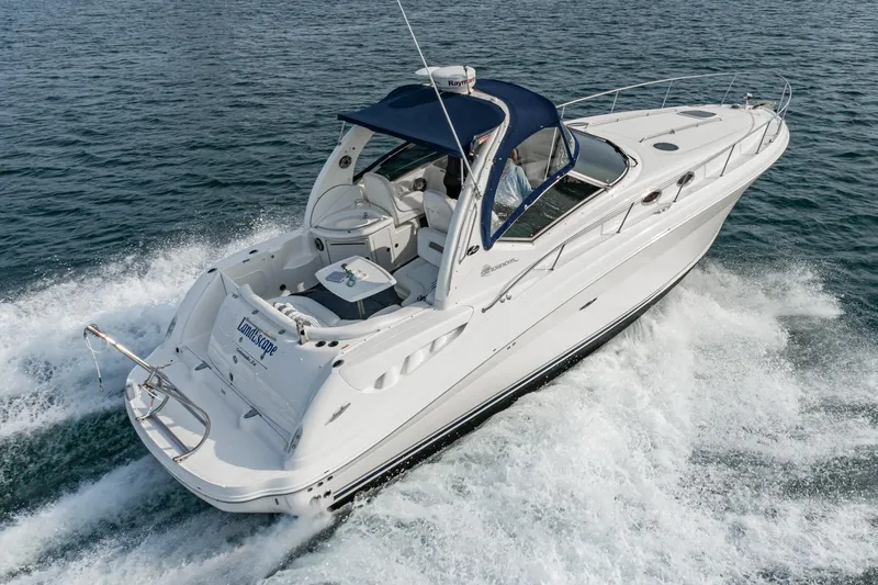 Slide: The Image of 2007 Sea Ray 340 Sundancer cruising on open water, showcasing sleek design and luxury features. - 10