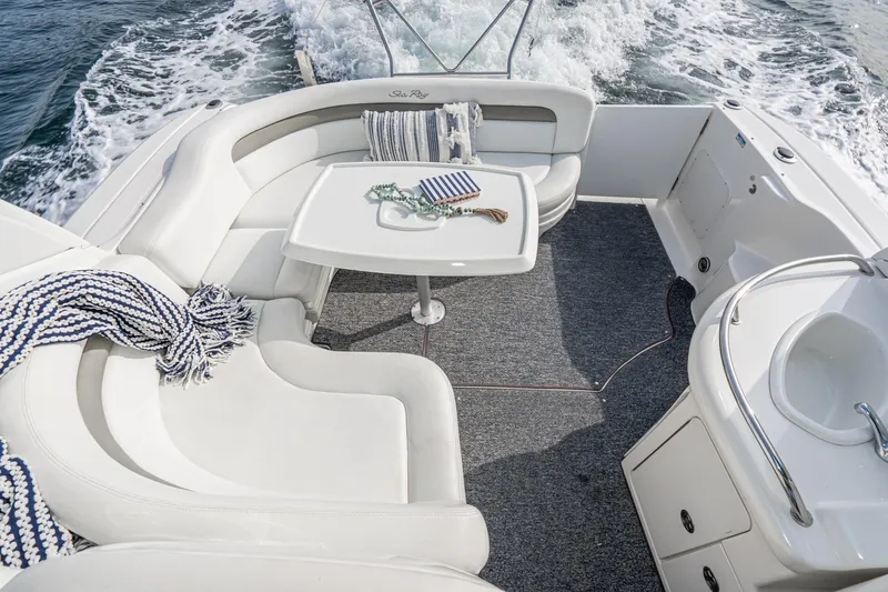 Slide: The Image of Luxurious 2007 Sea Ray 340 Sundancer boat interior with plush seating and table. - 19