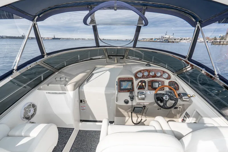 Slide: The Image of 2007 Sea Ray 340 Sundancer helm with modern controls and panoramic water view. - 22