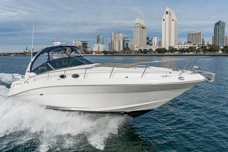 Slide: The Image of 2007 Sea Ray 340 Sundancer cruising near city skyline on a sunny day. - 3