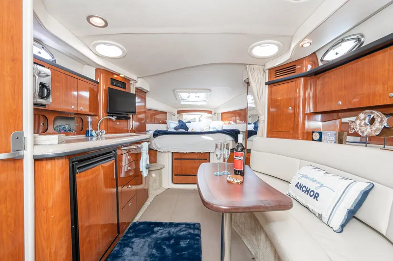 Slide: The Image of Luxurious 2007 Sea Ray 340 Sundancer cabin interior with kitchenette and cozy seating area. - 34