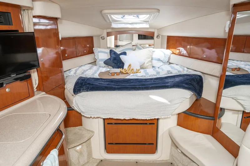 Slide: The Image of Luxurious 2007 Sea Ray 340 Sundancer cabin with cozy bed and elegant wood finishes. - 35