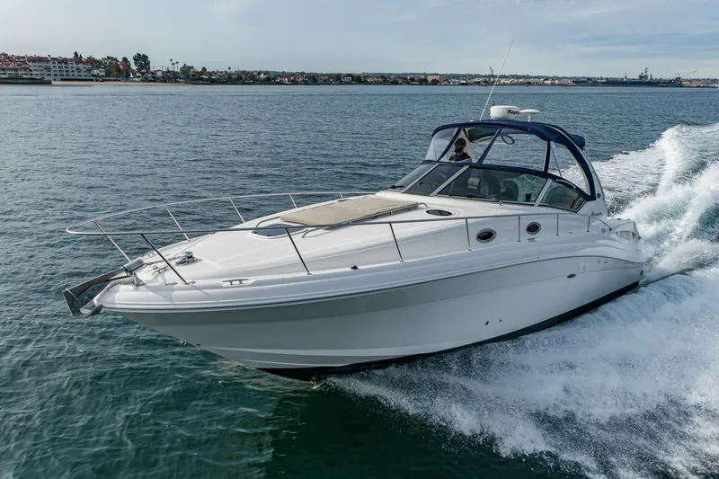 Slide: The Image of 2007 Sea Ray 340 Sundancer cruising on open water, showcasing sleek design and performance. - 4