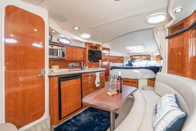 Slide: The Image of Luxurious interior of 2007 Sea Ray 340 Sundancer yacht with wood finishes and cozy seating. - 40