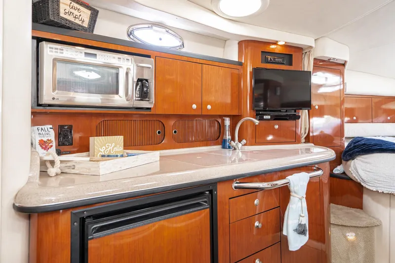Slide: The Image of Luxurious 2007 Sea Ray 340 Sundancer yacht interior with kitchenette and modern amenities. - 41