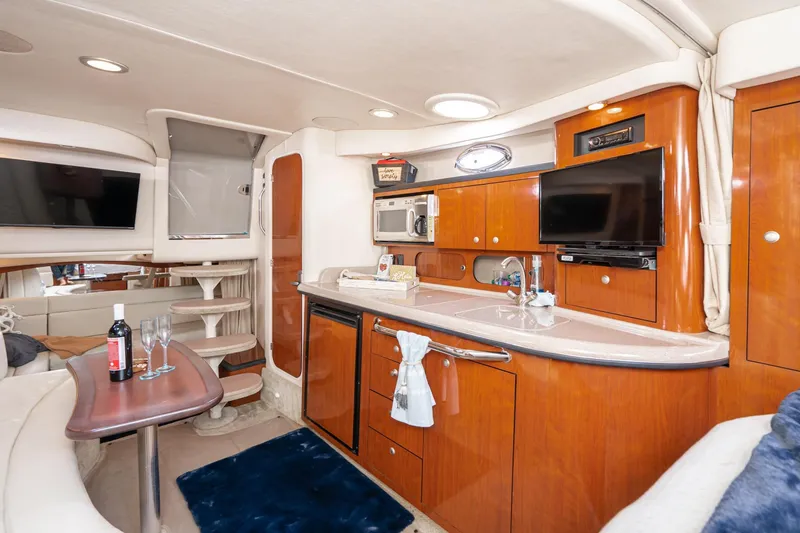 Slide: The Image of Luxurious interior of 2007 Sea Ray 340 Sundancer yacht with modern amenities and elegant wood finishes. - 42