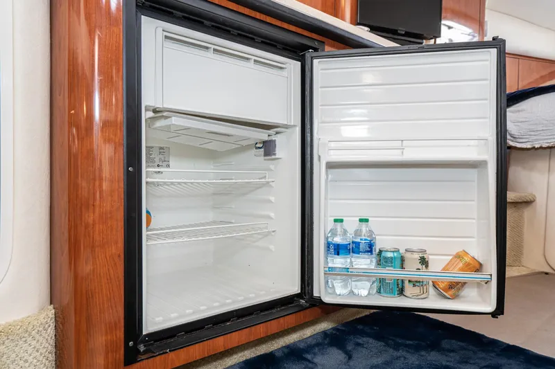 Slide: The Image of Open refrigerator inside 2007 Sea Ray 340 Sundancer yacht, stocked with drinks. - 45